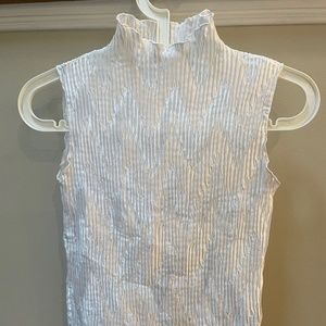 White sleeveless, mock-turtleneck top, size small.